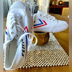 Brand New Stylish And Cool Pair Of Feiyues. Be The Coolest Of Your Gym Or College. Never Worn Sneakers. Feiyue Shoes, Worn Sneakers, 1920 Women, White Canvas Shoes, Top Sneakers Women, Mid Top Sneakers, Retro Streetwear, Print Sneakers, Solid & Striped