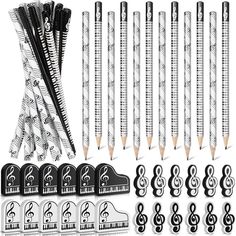 pencils and music notes are arranged on a white background