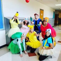 a group of people in costumes posing for a photo