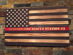 an american flag with the words medford fire - rescue station 3 written on it