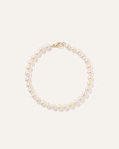 Classic luxury defined. Our 14K Gold Freshwater Cultured Pearl Bracelet has luminous freshwater pearls strung together in an organic design that never goes out of style. Finished with a lobster clasp for easy wear, this bracelet is the perfect arm candy for adding a touch of low-key glamour. Elegant Pearl Bracelet With Lobster Clasp And Round Beads, Everyday Pearl Bracelet With Pearl Charm, Everyday Pearl Charm Bracelet, Classic Single Strand Pearl Bracelet For Everyday, Classic Single Strand Beaded Bracelets For Everyday, Classic Everyday Single Strand Pearl Bracelet, Classic Everyday Beaded Bracelets With Pearl Charm, Classic Everyday Pearl Chain Bracelets, Classic Everyday Pearl Bracelet With Pearl Charm