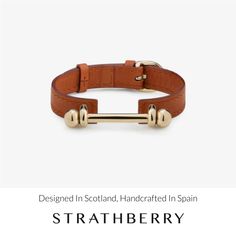 Handcrafted from the highest quality leather, the strathberry music bar bracelet will add a stylish touch to any look. Featuring our signature music bar hardware, finely crafted in italy, and an adjustable buckle closure to suit a variety of sizing options, this contemporary bracelet is designed to be cherished for years to come. This strathberry bracelet features leather handcrafted in spain, and our hardware detailing finely crafted in italy. All pieces are presented in a velvet-lined luxury gift box, the perfect finishing touch for that special someone or as a treat for yourself. Modern Adjustable Bracelets With Gold-tone Hardware, Modern Adjustable Jewelry With Gold-tone Hardware, Adjustable Gold Leather Bracelet With Gold-tone Hardware, Elegant Adjustable Bracelets With Gold-tone Hardware, Elegant Adjustable Bracelet With Gold-tone Hardware, Modern Bracelets With Gold-tone Hardware, Adjustable Leather Bracelets With Gold-tone Hardware, Luxury Leather Bracelet For Everyday, Modern Leather Strap Cuff Bracelets