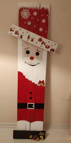 a christmas door decoration with santa clause on it