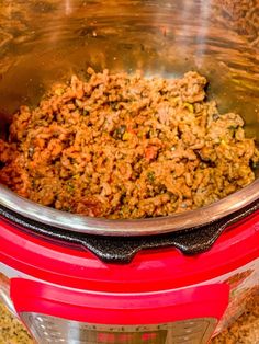 a pot full of food sitting on top of a counter