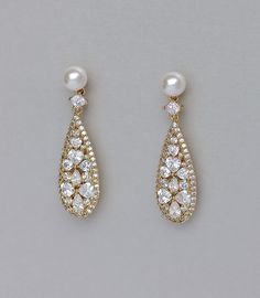 "Rita earrings have been created in a modern vintage filigree long teardrop with a pearl stud post for a graceful and super sparkling bridal accessory. Very light and comfortable to wear, they're a perfect finish to your wedding dress accessorizing whether it's modern or in a vintage style. Choose your pearl color as we make all our own pearl posts! Measurements - L = 1.7\" (4.3cm) High quality CZ crystals set in tarnish resistant 18 K gold plate, nickel free, allergy free. ★Shopping for your br Elegant Teardrop Pendant Earrings For Wedding, Wedding Teardrop Pendant Earrings For Pierced Ears, Pierced Teardrop Pearl Earrings, Elegant Teardrop Chandelier Earrings, Delicate Teardrop Earrings With Elegant Design, Pierced Drop Bridal Earrings For Wedding, Elegant Drop Bridal Earrings, Teardrop Pierced Earrings For Wedding, Wedding Teardrop Dangle Earrings