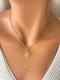 "This is a gold St. Michael oval pendant necklace.  This beautiful pendant is 16 karat gold over 925 sterling silver, measures 22x14mm and comes on 14 karat gold filled box chain.  Model has a small neck, is wearing 16\" length.  Also available in 18 or 20 inch length.  Please choose gold or silver version which is all completely 925 sterling silver, including box chain .  Choose your length in the drop-down list. Comes in the gift box ready to present. This would make a great gift for women, girls or boys. I do make a larger oh well, Saint Michael pendant necklace for men on another listing. Please pay attention to delivery time on this listing. I do offer shipping upgrades at checkout for faster delivery." Necklace Women Silver, St Michael Necklace, Catholic Confirmation Gifts, Catholic Confirmation, St Michael Pendant, Saint Michael, Great Gifts For Women, Protection Necklace, Confirmation Gifts