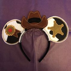 a mickey mouse ears with some decorations on it