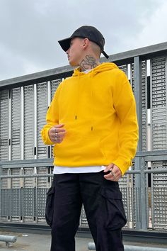 Available In Black, Heathered Grey, White, Navy, Red, Orange, Pink, Blue, And Yellow Hood With Drawstring Long Sleeve Kangaroo Pocket Ribbing On Cuffs And Hem 80% Cotton 20% Polyester Imported | Mens Tyson Hoodie in Yellow size XL by Fashion Nova Yellow Top Outfit, Bright Colored Outfits, Hoodie Outfit Men, Yellow Pants, Street Style Outfits Men, Black Dress Outfits, Yellow Hoodie, Yellow Outfit, Button Down Shirt Mens