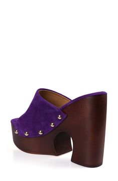 Polished midsole studs add retro-cool styling to a statement-making sandal lifted by a sculptural platform and woodgrain block heel. 4" heel; 2" platform Leather upper, lining and sole Imported Wooden Block Heel Platform Shoes, Wooden Platform Heels, Purple Suede, Platform Slides, Sandal Women, Slide Sandals, Block Heels, Womens Sandals, Leather Upper