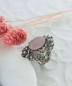 Rose Quartz Silver Oval Floral Statement Ring, 925 Sterling Artisan Made Handcrafted Flower Filigree Cocktail Ring Handmade Women Jewelry Pink stone ring, floral ring, flower basket ring, vintage ring, anniversary gift, birthday gift Material: 925 Sterling Silver (NICKEL FREE) Gemstone: Rose Quartz 10x14 mm. FREE, FAST AND TRACKABLE SHIPPING FOR ALL EU COUNTRIES AND USA. COMES WİTH VELVET POUCH AND LUXURY GİFT BOX. Show off this gorgeous ring at any occasion. This eye catching elongated oval sta Oval Flower Ring For Wedding, Handmade Ornate Rings, Oval Silver Filigree Ring Bohemian Style, Handmade Ornate Oval Ring, Silver Oval Filigree Ring In Bohemian Style, Silver Oval Filigree Bohemian Ring, Silver Oval Flower Ring For Wedding, Silver Flower Ring With Stone Setting As Gift, Handmade Oval Filigree Ring For Gift