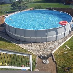 an above ground swimming pool in a backyard