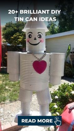 an inflatable robot is sitting on the ground with text reading, 20 brilliant diy tin can ideas read more