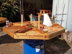 a blue barrel sitting on top of a wooden table