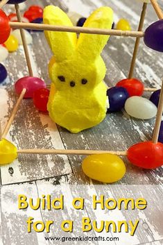 an easter decoration made out of candy and marshmallows with the words build a home for a bunny