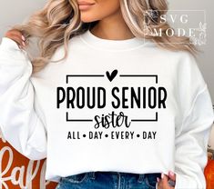 a woman wearing a white shirt with the words proud senior sister all day every day