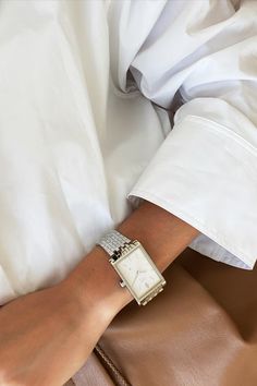 Woman wearing VIEREN Matte White watch with white shirt and leather pants Become A Minimalist, Rectangular Watch, White Watches For Men, Swiss Automatic Watches, Swiss Luxury, Swiss Made Watches, White Watch, White Dial, Swiss Made