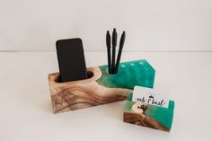 a cell phone and pen holder made out of wood