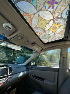 the interior of a car with a decorative glass ceiling in the passenger side window and sunroof