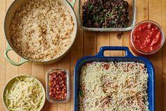 the food is prepared and ready to be cooked in the oven, including rice, beans, tomato sauce, and other condiments