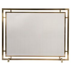 a white and gold fireplace screen