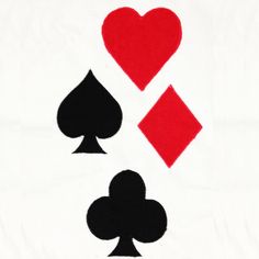 two playing cards with hearts and spades drawn on them in red, black and white