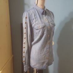 Nwt. Jessica Simpson. Size M. Medium Blue Denim Button Up Top. Long Sleeves With Copper Grommets And Buttons Medium Wash Chambray Tops With Buttons, Light Blue Button-up Denim Top, Denim Blue Chambray Top With Buttons, Light Wash Chambray Top With Buttons, Fitted Chambray Top With Buttons, Blue Button-up Denim Top With Button Cuffs, Blue Denim Button-up Top With Button Cuffs, Washed Blue Chambray Denim Top With Buttons, Washed Blue Button-up Denim Top