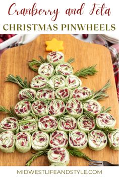 a christmas tree made out of rolls on top of a cutting board with the words cranberry and feta christmas pinwheels