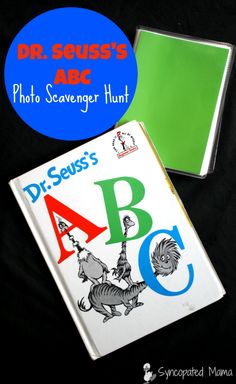 the dr seusss abc photo scavenger hunt book is next to a cd case