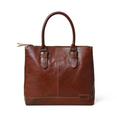 Introducing the City Chic Brown Leather Shoulder Tote—a versatile office bag designed for elegance and practicality. With a central compartment, inside pocket, and sturdy handles adorned with stylish buckles, it seamlessly blends class with functionality. Crafted from naturally tanned buffalo leather, this bag effortlessly transitions from office sophistication to casual chic. Perfect for brunch or quick outings with friends, it complements your style while prioritizing environmental responsibil Leather Briefcase With Detachable Handle For Business, Business Leather Briefcase With Detachable Handle, Workwear Briefcase With Leather Handles And Shoulder Bag Shape, Business Leather Laptop Bag With Detachable Handle, Classic Leather Briefcase With Detachable Handle, Classic Laptop Bag With Double Handle For Daily Use, Business Briefcase With Detachable Handle In Tote Shape, Business Briefcase With Detachable Handle And Tote Shape, Cognac Soft Leather Satchel For Office