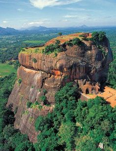 an aerial view of a rock formation in the jungle