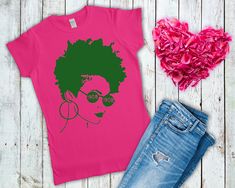 a t - shirt with an afro woman's face on it