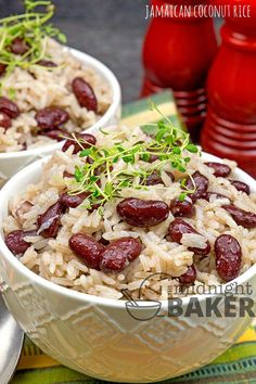 two white bowls filled with rice and beans