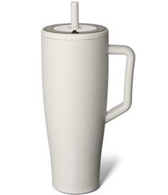 a white coffee cup with a lid and handle on the side is shown in front of a white background