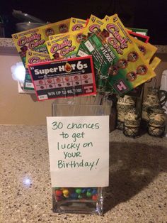 a birthday card holder with candy in it and a sign that says 30 crannes to get lucky on your birthday