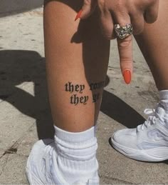 a woman's leg with the words they cannot fly tattooed on her left calf