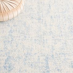 a blue and white rug on the floor