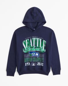 Comfy popover hoodie in our soft fleece fabric, featuring Seattle Seahawks-inspired graphic detail at chest, front pouch pocket, ribbed hem and thumbholes at cuffs. Boys Tops, Abercrombie Kids, Boys Hoodies, Seattle Seahawks, Boys Top, Hoodie Girl, Fall 2024, Hoodie Top, Dallas Cowboys