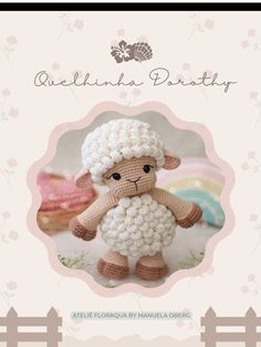 a crocheted sheep is standing in front of a card