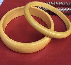 Vintage pair of mustard yellow Bakelite bangle bracelets circa 1940's. One bangle it thick the other one is thin and they compliment each other. The smaller Bakelite filler has lots of flaws it has scratches showing it was well loved and used. The bigger and thicker one is in more better shape less scratches Bakelite Bangles, Mustard Yellow, Bangle Bracelets, Mustard, Jewelry Bracelets, Bangles, Yellow, Jewellery Bracelets