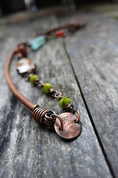 Earthy and organic copper/leather necklace where every bead is the focus.  Beautiful with scarves, layered with more like pieces and also great all alone for I wear mine just as it is :)   So comfortable! Some of the steps involved: wrapping, tumbling, attaching, oxidizing and then finishing up with sanding away the high points to give expression of detail. 22 inches long enjoy,   Stephanie www.stephaniedistler.com Clasp Necklace, Jewelry Techniques, Petrified Wood, Leather Necklace, Leather Jewelry, Wire Wrapped Jewelry, Artisan Jewelry, Wire Jewelry, Necklace Etsy