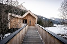 a wooden walkway leading up to a building