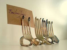 there are forks that have been placed next to each other on a card with the word business time written on it