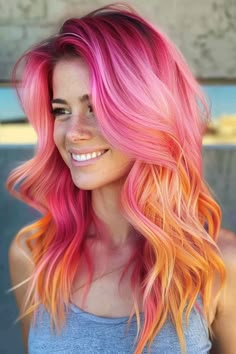 Click for More ➡️ | Save for Later ❤️  Create a fiery and fun look with a pink and orange ombre. This vibrant color combination is perfect for long hair and adds a unique touch to your style. (Pink and Orange Ombre for Long Hair) Light Vivid Hair Color, Pink Orange And Blonde Hair, Pink And Coral Hair, Pastel Pink And Orange Hair, Orange To Pink Hair, Pop Of Color Hair Ideas, Pink To Orange Hair, Fire Color Hair, Fun Colors For Hair