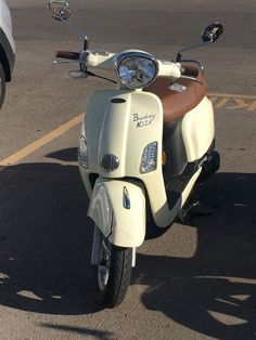 a scooter is parked in a parking lot