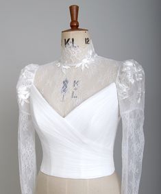 This is a short cover up that needs to be attached by poppers/snaps around the neckline of your dress. Beautiful detachable long sleeve jacket, perfect for the bride looking to enhance her wedding dress but it's also ideal for those who need of an extra layer either for the sake of appearing modest for a church ceremony or in chillier weather. This delicate cover up is fastened via the back with beautiful buttons and comes with snaps - front, sides and back necessary to attach them to your dress.  The corset is not included! Fabric samples are available for you to check the quality and to match the colour of your wedding dress. Link for the samples: https://www.etsy.com/uk/listing/1110356913/fabric-samples?click_key=12f16b37b8ed940454f859f9d61510ceed5a4a12%3A1110356913&click_sum=17247f9a&r White Tops With Sweetheart Neckline For Wedding, Fitted White Top For Wedding Night, Filipiniana Dress, Bride And Groom Outfits, Burmese Clothing, Crochet Shrug Pattern, Traditional Dresses Designs, Bridal Bolero, Lace Bolero