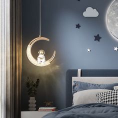 a bed room with a neatly made bed and a night light hanging from the ceiling