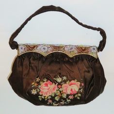 You have found the missing piece to your Handbag Collection! Here is a Beautiful Clutch, Purse or Handbag from Maroquinerie, Mona Lise, Paris. It features a Brown Cloth Bag & Strap with Embroidered Flowers and a Beaded Clasp. The bag is about 9" across by 6 1/2 long, and is in excellent preowned condition, but the Label is Loose (See Pictures). Please see our Not Just China Store for more Accessories & Collectibles. We try to ship within 24 hours of receiving payment. If you have questions or yo Vintage Embroidered Formal Bags, Antique Embroidered Evening Bags, Formal Embroidered Handheld Shoulder Bag, Vintage Embellished Pouch Bag, Evening Embroidered Brown Shoulder Bag, Vintage Embroidered Evening Bags, Victorian Embroidered Evening Bags, Traditional Brown Formal Bag, Vintage Formal Bag With Floral Embroidery