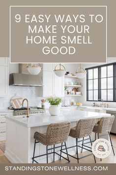 a kitchen with white cabinets and an island in front of the countertop is featured