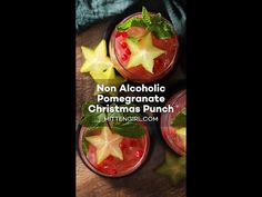 three glasses filled with christmas punch on top of a wooden table