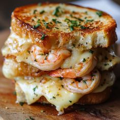 a grilled cheese sandwich with shrimp on it